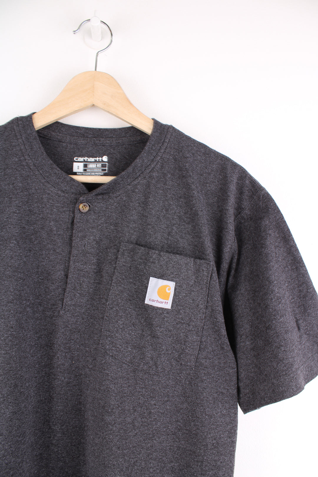 Dark grey Carhartt loose fit t-shirt with branded pocket three button detail 