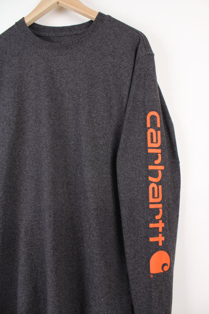 Dark grey Carhartt loose fit, long sleeve t-shirt with spell-out branding down the sleeve 