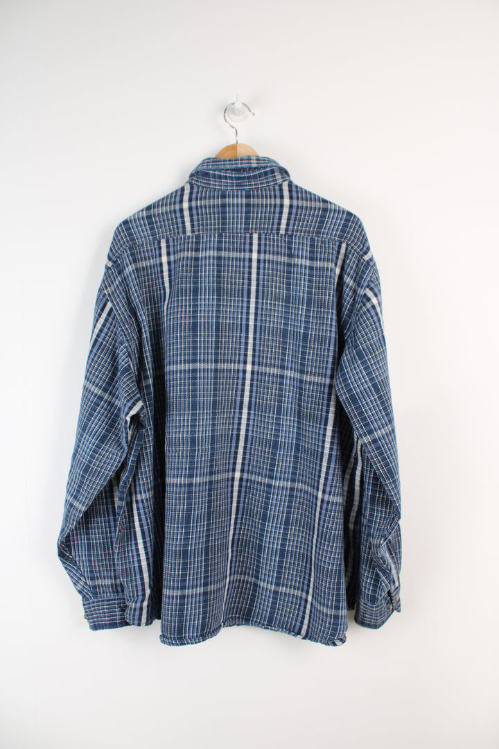 Navy blue plaid Carhartt button up shirt, has small embroidered logo on chest pocket