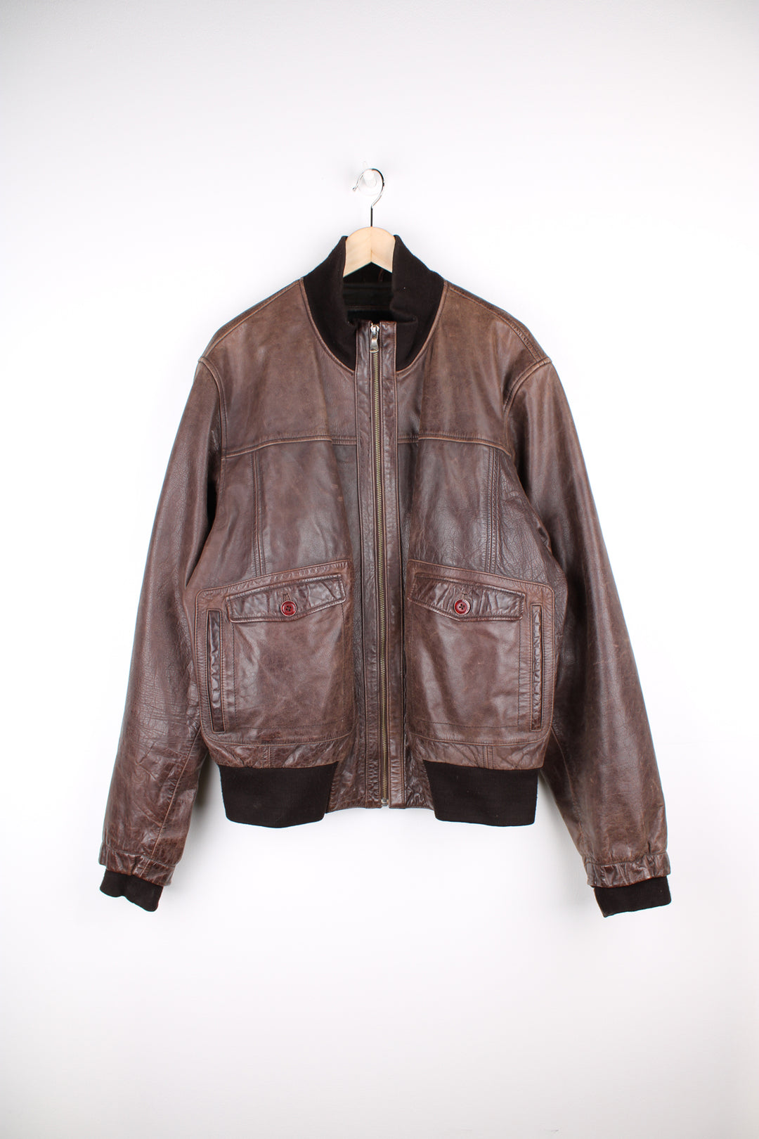 Vintage CAT brown, leather bomber jacket. Features elasticated cuffs/ waistband and closes with a full zip.  Good condition - Some scuffs and scratches to the leather (see photos) Size in Label  Mens XL