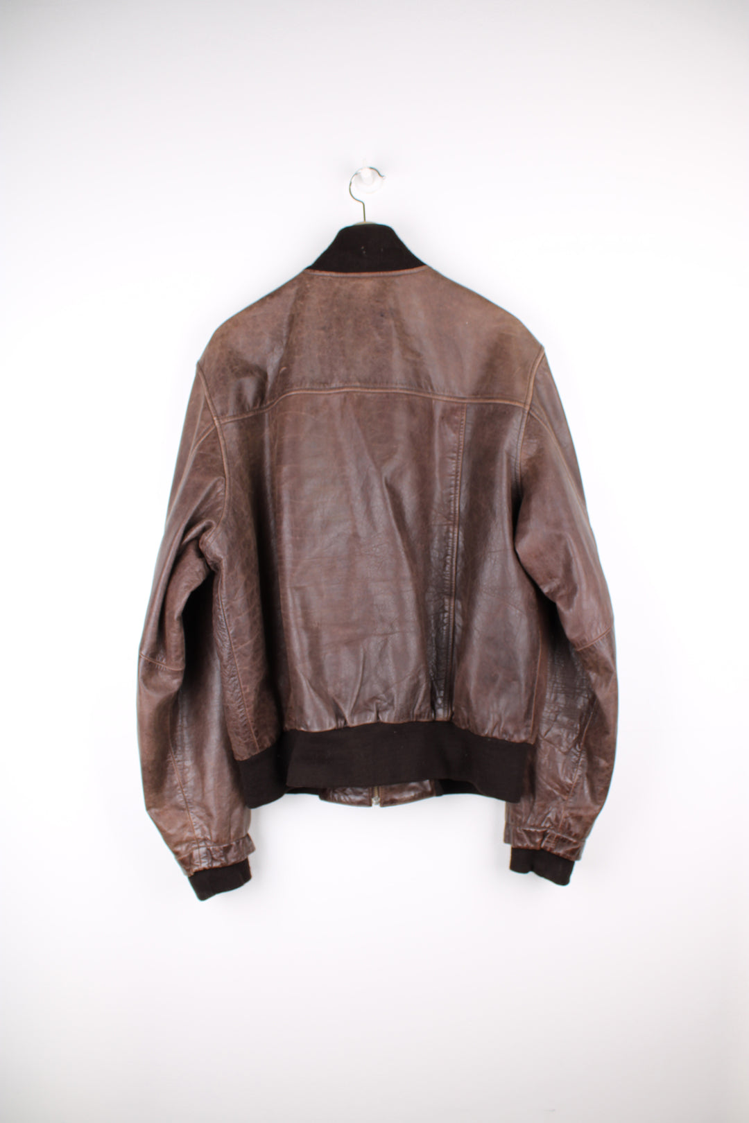 Vintage CAT brown, leather bomber jacket. Features elasticated cuffs/ waistband and closes with a full zip.  Good condition - Some scuffs and scratches to the leather (see photos) Size in Label  Mens XL