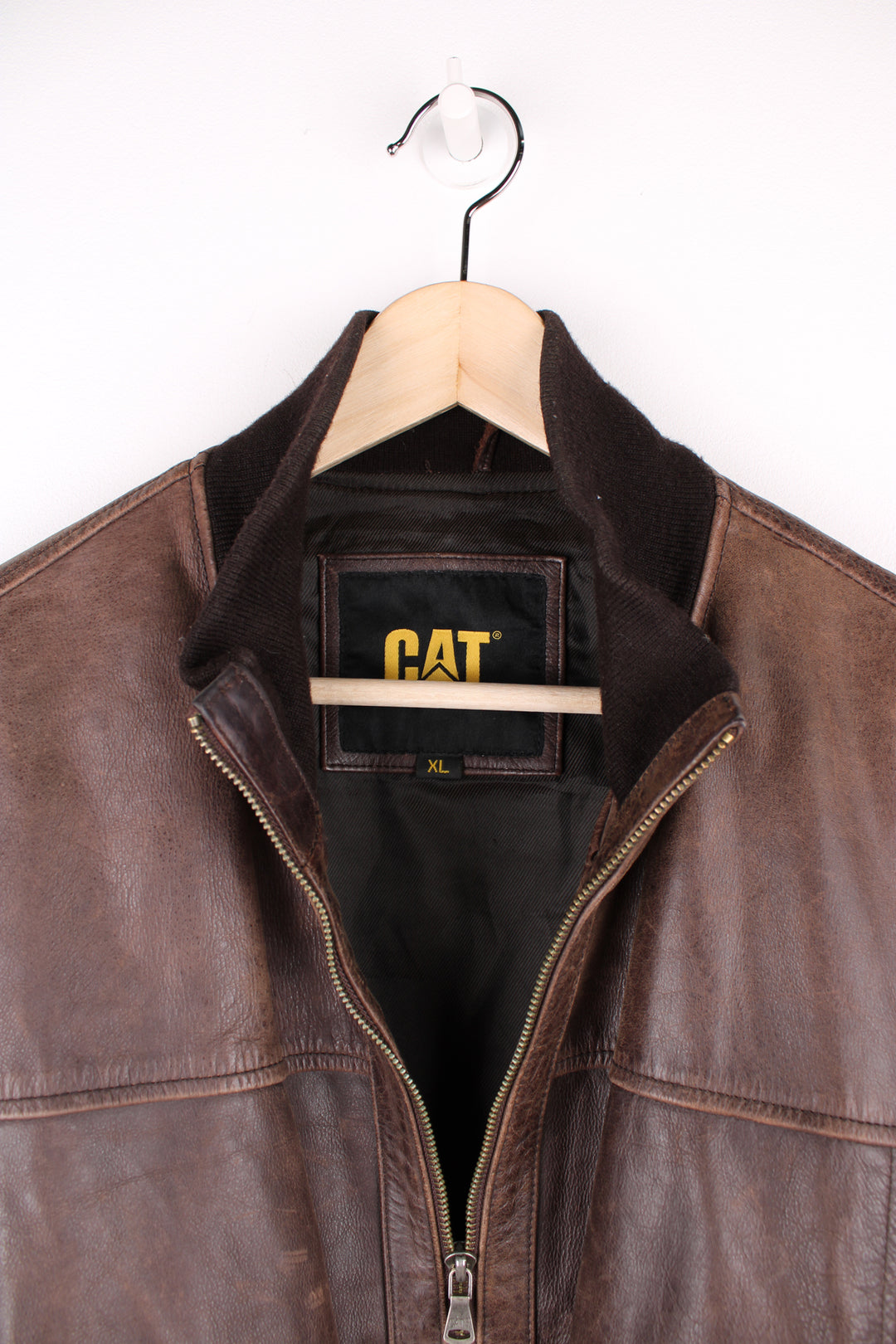 Vintage CAT brown, leather bomber jacket. Features elasticated cuffs/ waistband and closes with a full zip.  Good condition - Some scuffs and scratches to the leather (see photos) Size in Label  Mens XL