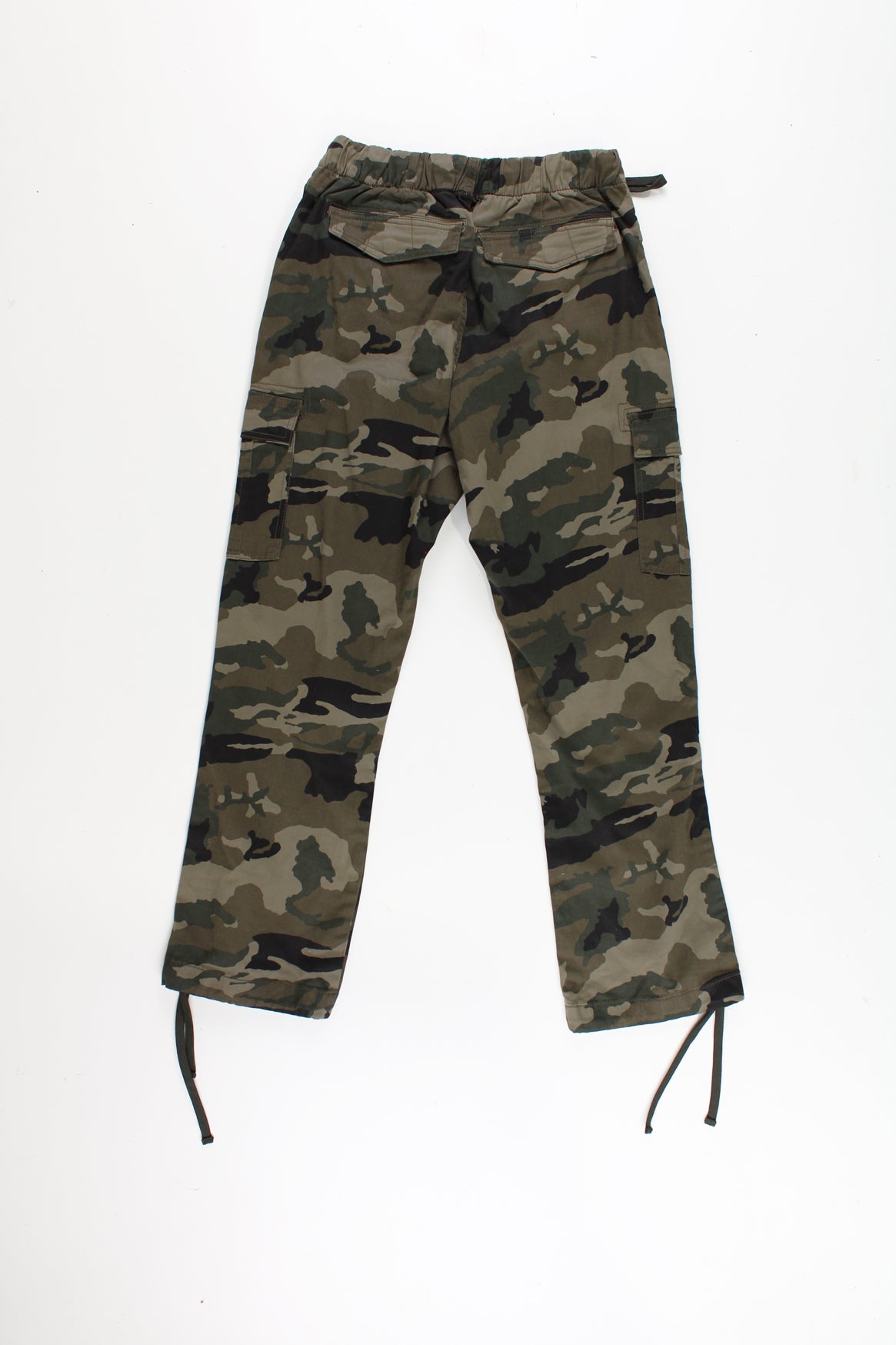 Bench Camo Cargo Trousers in a green, black and brown colourway, multiple utility style pockets, adjustable waist and cuffs, and has the logo embroidered on the front pocket.