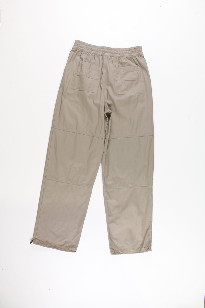 Reebok high waisted, cargo trousers with popper button closures, multiple pockets and embroidered logo on the hip