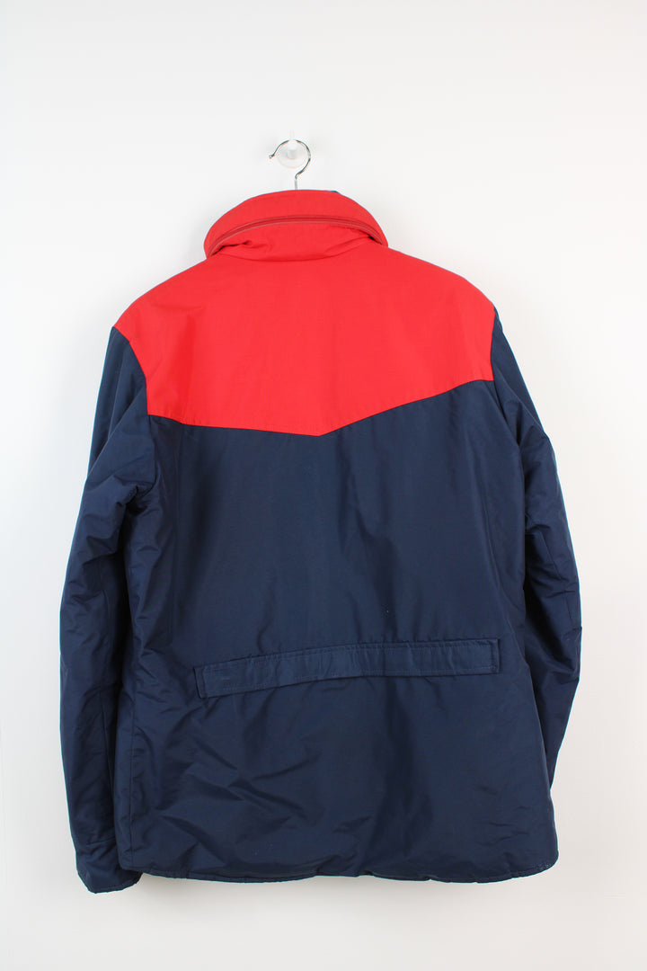 Vintage Berghaus blue and red 'Chamonix' insulated jacket,  with zip/snap button fastenings, foldaway hood and zip up pockets