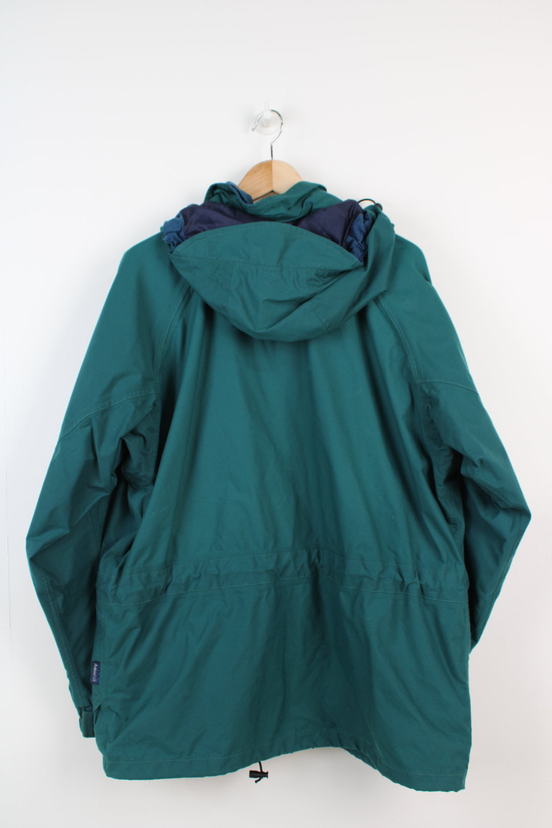 Vintage Berghaus 'Palisade I.A' green outdoor jacket with embroidered logo on the pocket, drawstring waist and hood