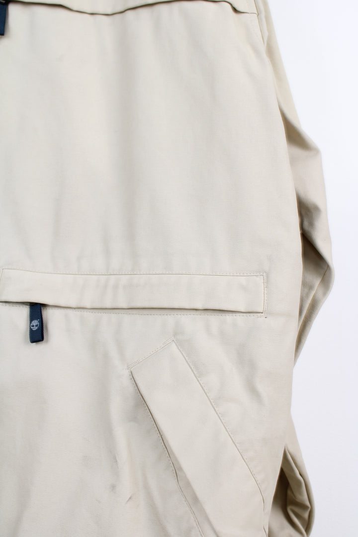 Timberland Performance cream / light tan zip through, waterproof jacket with multiple pockets and embroidered logo on the sleeve