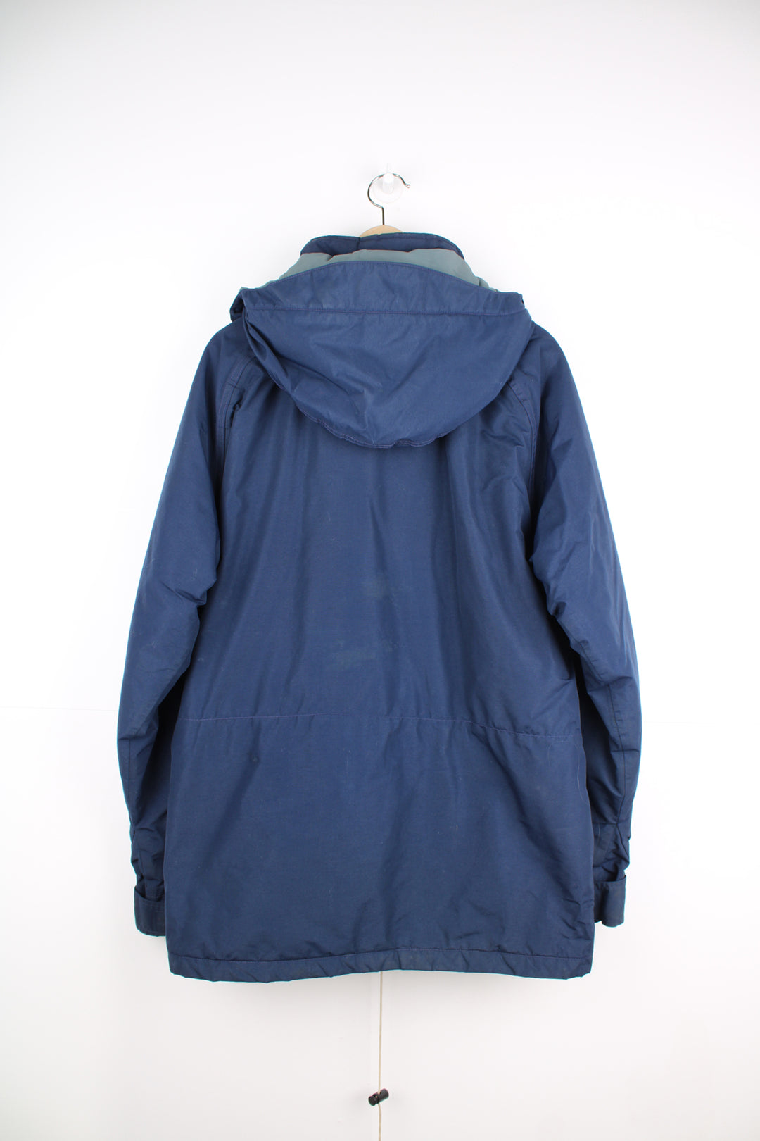 The North Face Goretex Jacket in a blue colourway, parka style, zip up, multiple pockets, hooded and has a insulated lining.