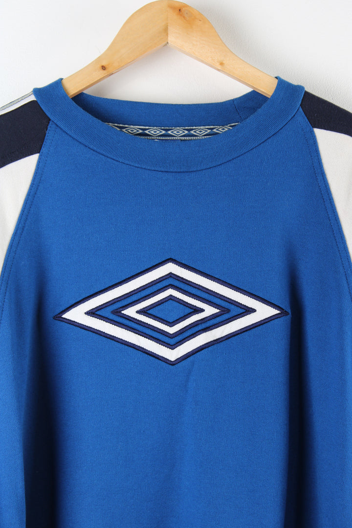 Vintage 90's Umbro bright blue sweatshirt, features embroidered logo on the front and branded ribbon down both sleeves 