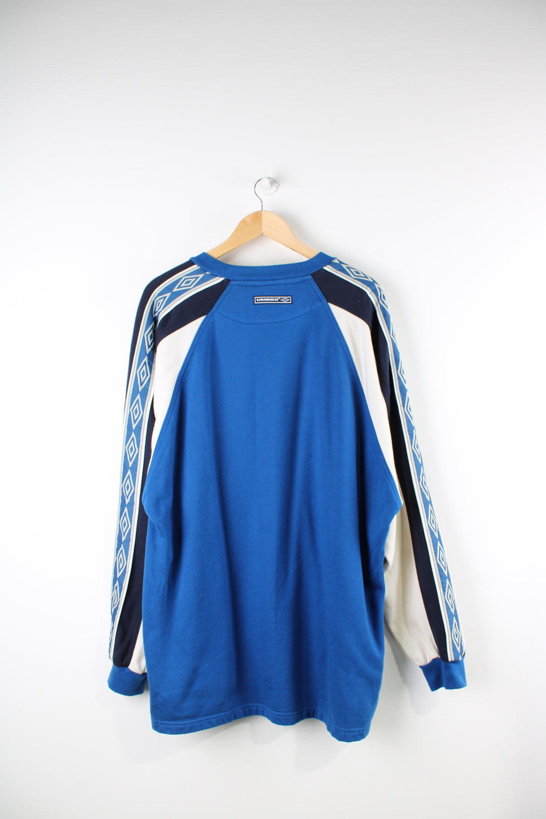 Vintage 90's Umbro bright blue sweatshirt, features embroidered logo on the front and branded ribbon down both sleeves 