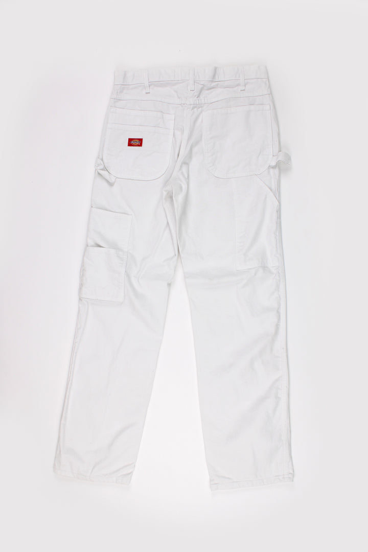 Dickies all white carpenter style jeans with multiple pockets and white contrast stitching