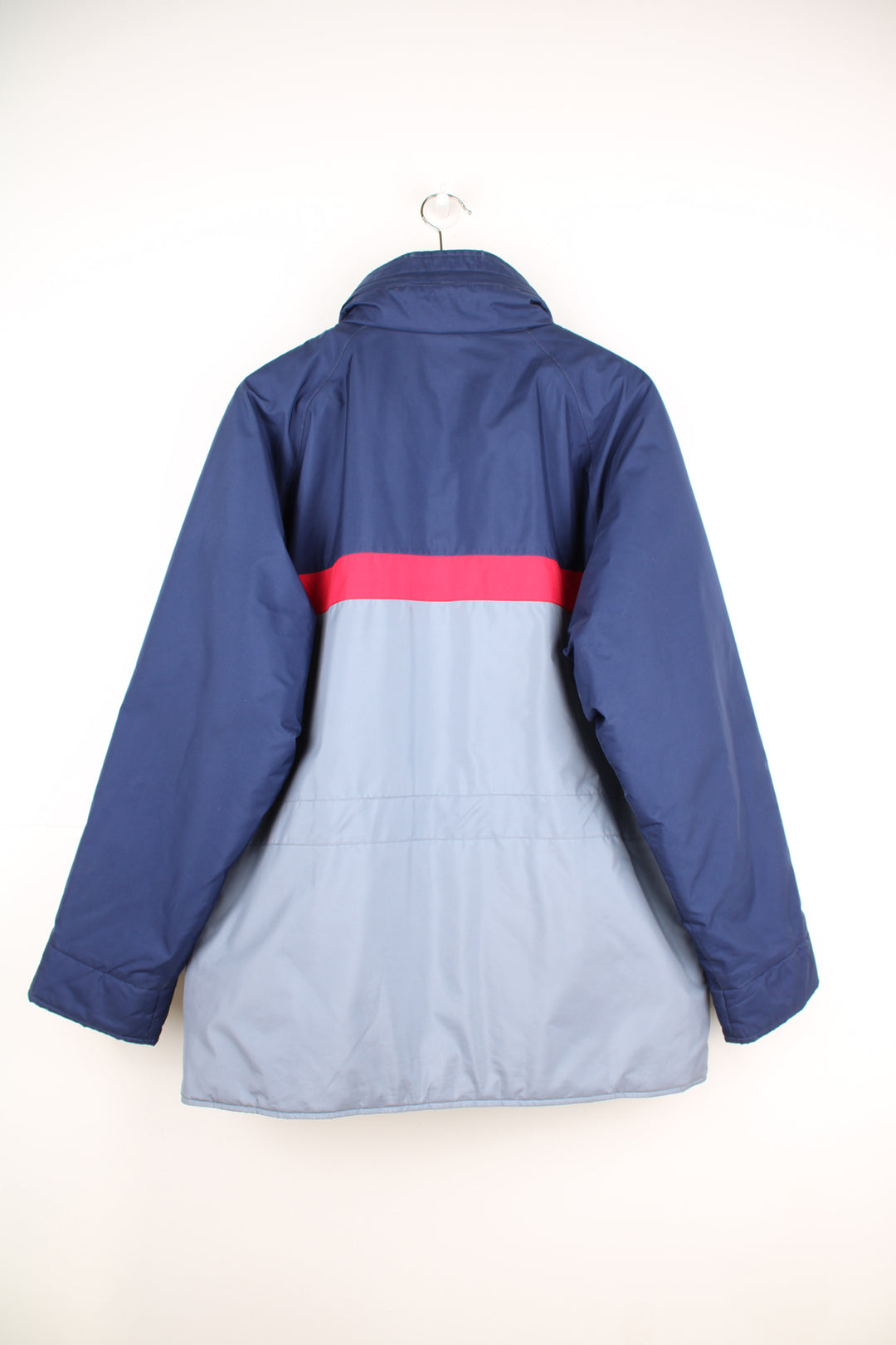 Berghaus Goretex Jacket in a blue and grey colourway, zip up, multiple pockets, hidden hood, has a insulated lining and the logo embroidered on the front.