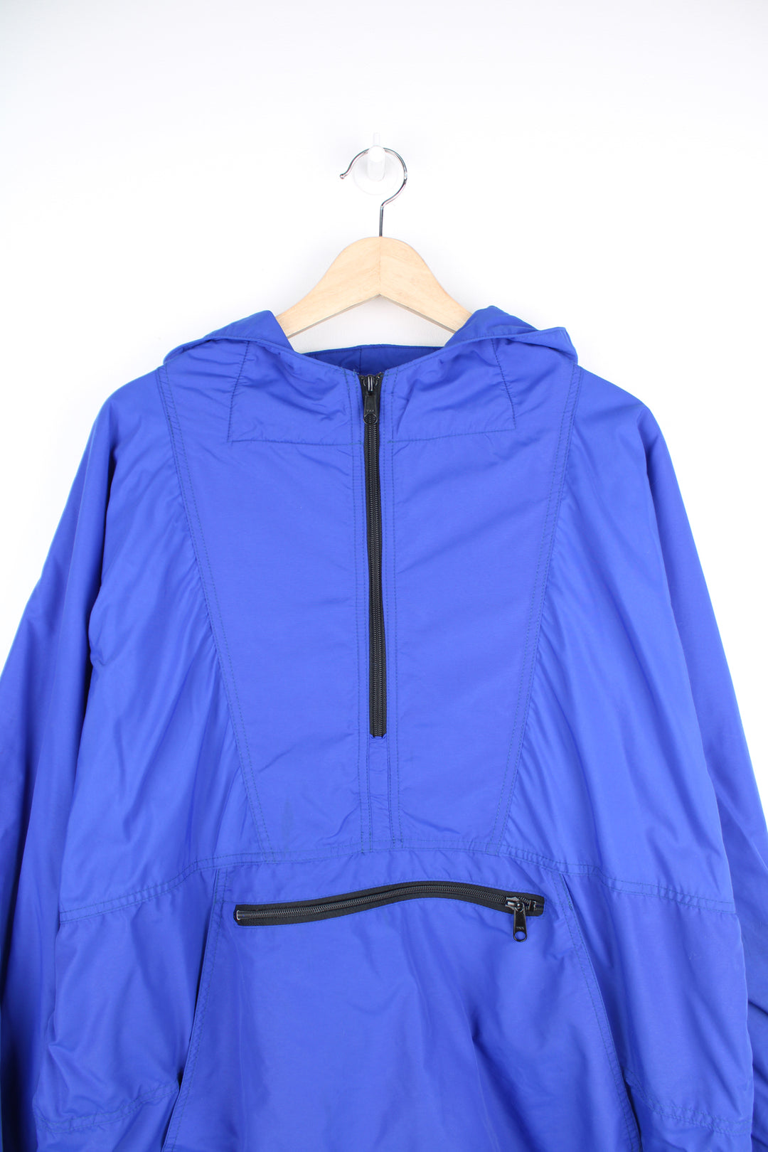 L.L. Bean Anorak Jacket in a blue colourway, half zip, big pouch pockets, fleece lining, hooded, and has the logo embroidered on the front.