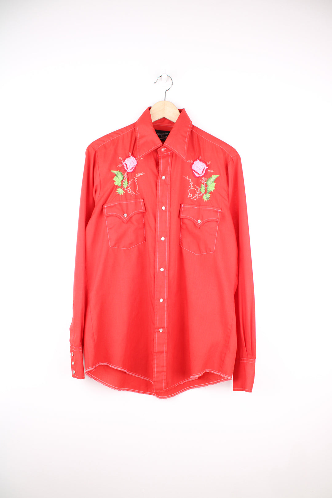 Vintage 70's/80's Champion Westerns all red western shirt, features embroidered roses , pearl snap buttons and yoke on the front and back 