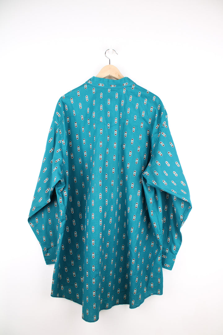 Vintage Wrangler button up shirt in teal blue/green, features all over western style print and yoke on the back