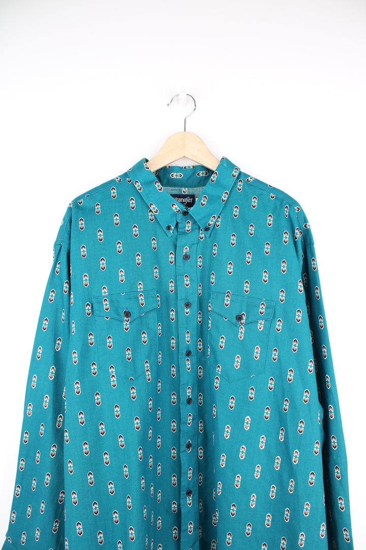 Vintage Wrangler button up shirt in teal blue/green, features all over western style print and yoke on the back