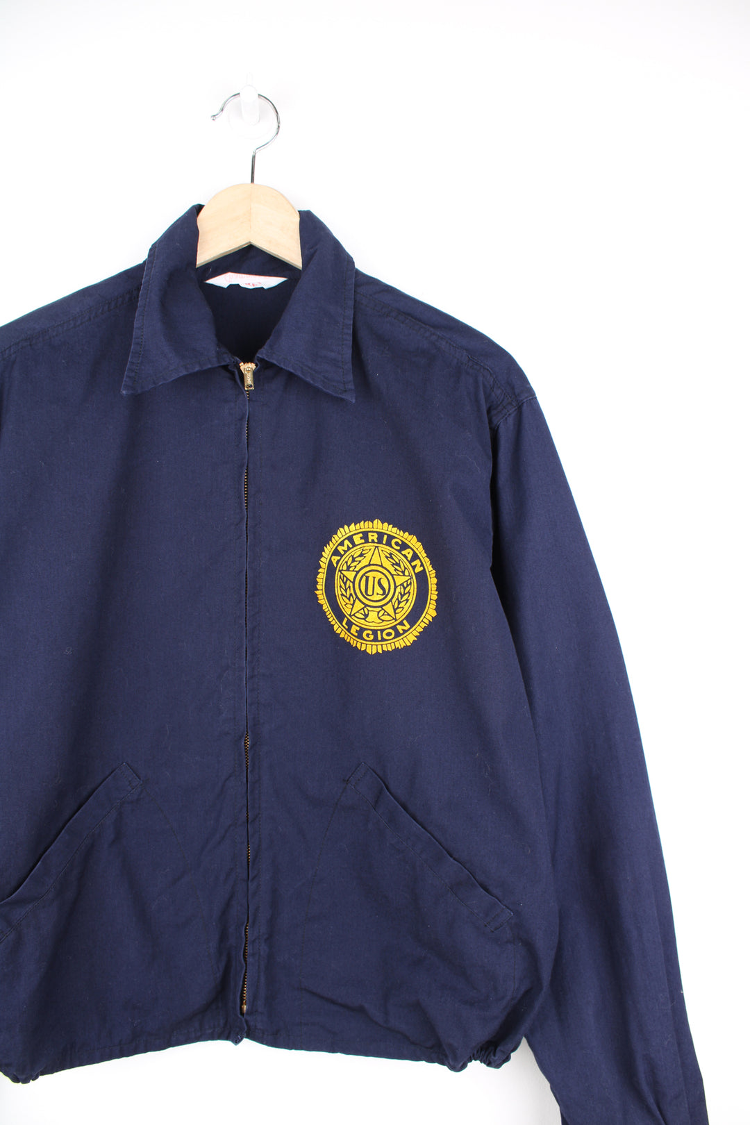 Vintage looks like 70's navy blue zip through American Legion cotton cropped bomber jacket with printed badge on the chest and spell-out 'Carson Valley Post #11' on the back