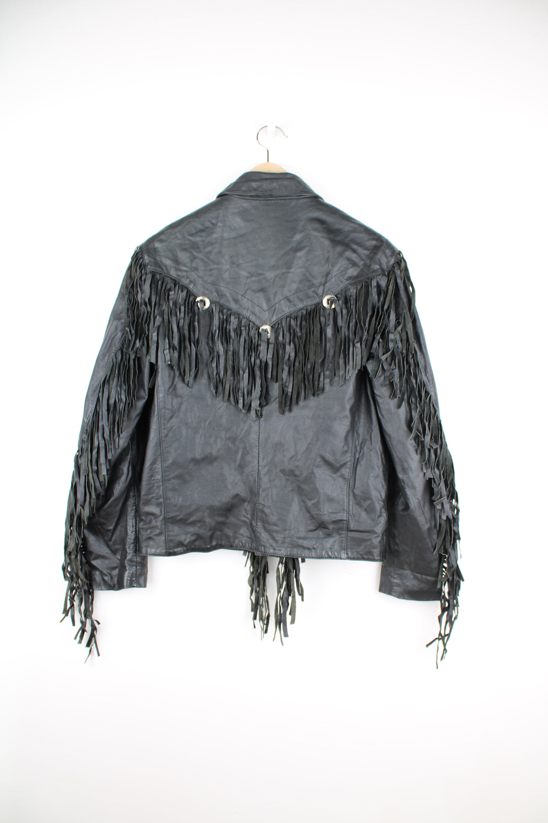 Vintage Wilson's black zip through leather jacket with fringe details on the back of the shoulders and silver conch buttons 