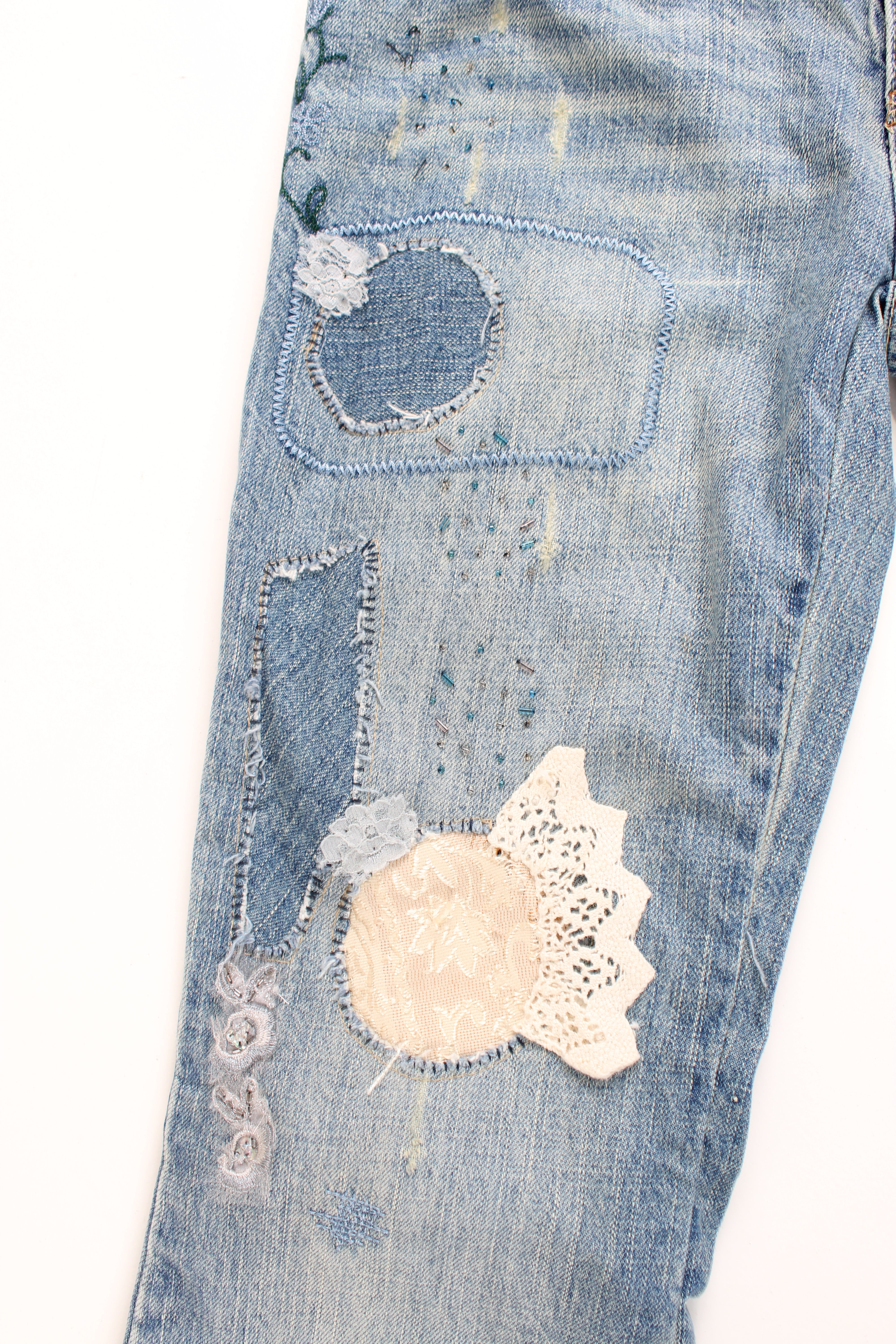 New Look low rise distressed jeans with multiple pockets, and has embroidered patterns and distressed style throughout the jeans.