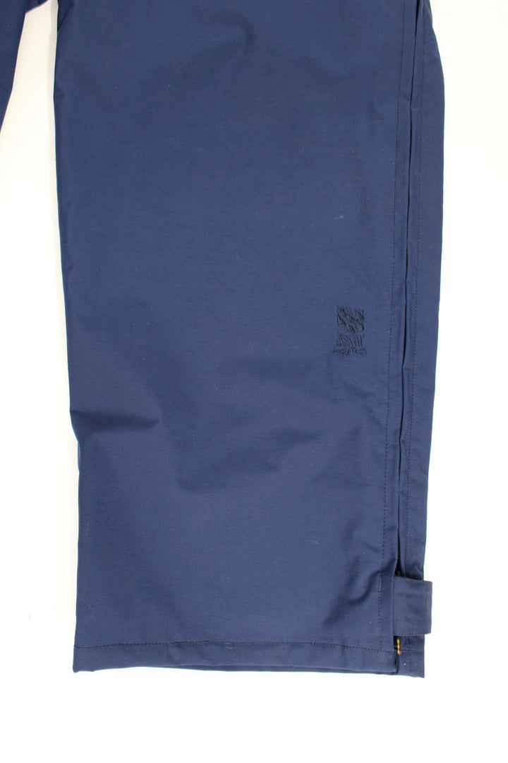 Helly Hansen Walking Trousers in a blue colourway, zip down the side of the legs and has the logo embroidered on the front.