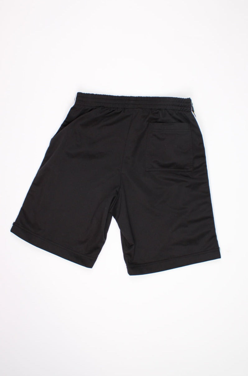 Vintage 90's Kappa football style sport shorts with branded ribbon on the side of the leg