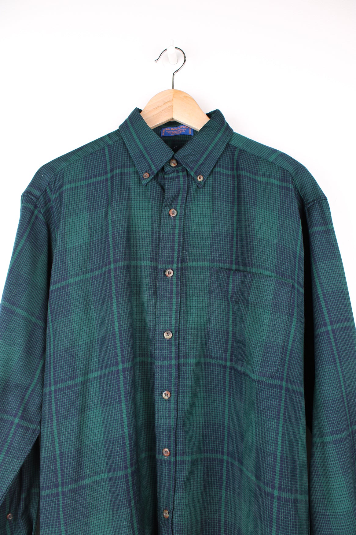 Vintage Pendleton green plaid, 100% wool button up shirt. features chest pocket