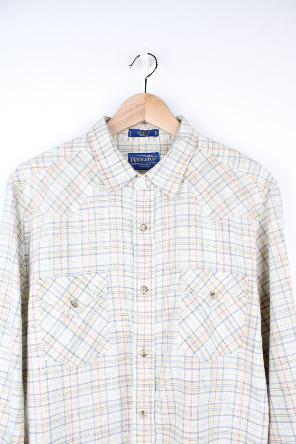 Pendleton pale yellow, plaid button up shirt. Made from 100% cotton, features western style yoke and pearl effect popper buttons