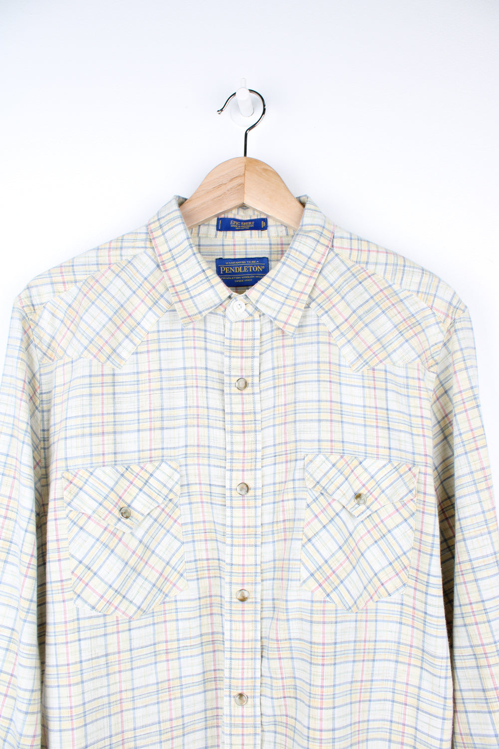 Pendleton pale yellow, plaid button up shirt. Made from 100% cotton, features western style yoke and pearl effect popper buttons