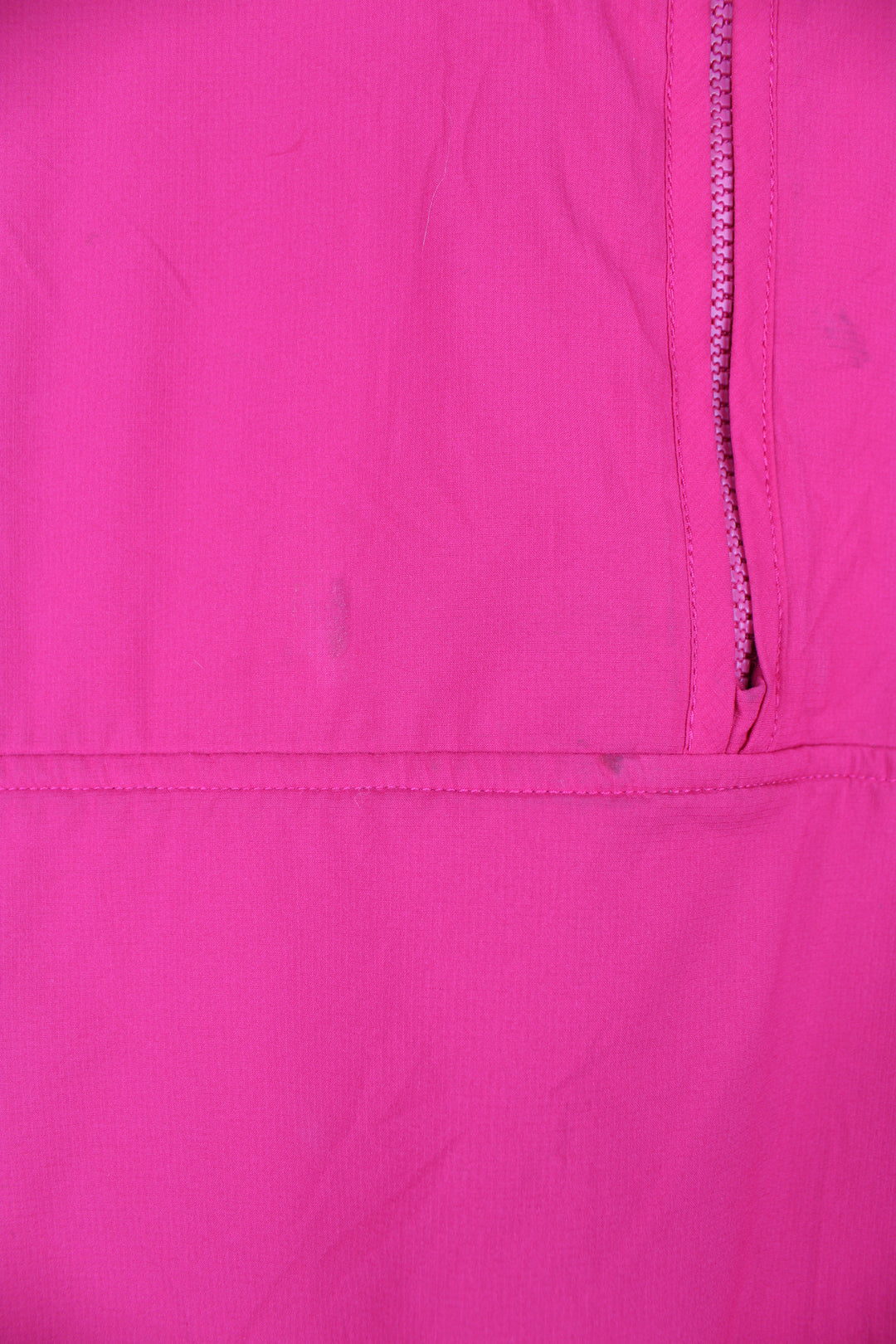 Patagonia Reversible Fleece in either a purple or pink colourway with a fleece or shell option, half zip, pockets and has the logo embroidered on the front.