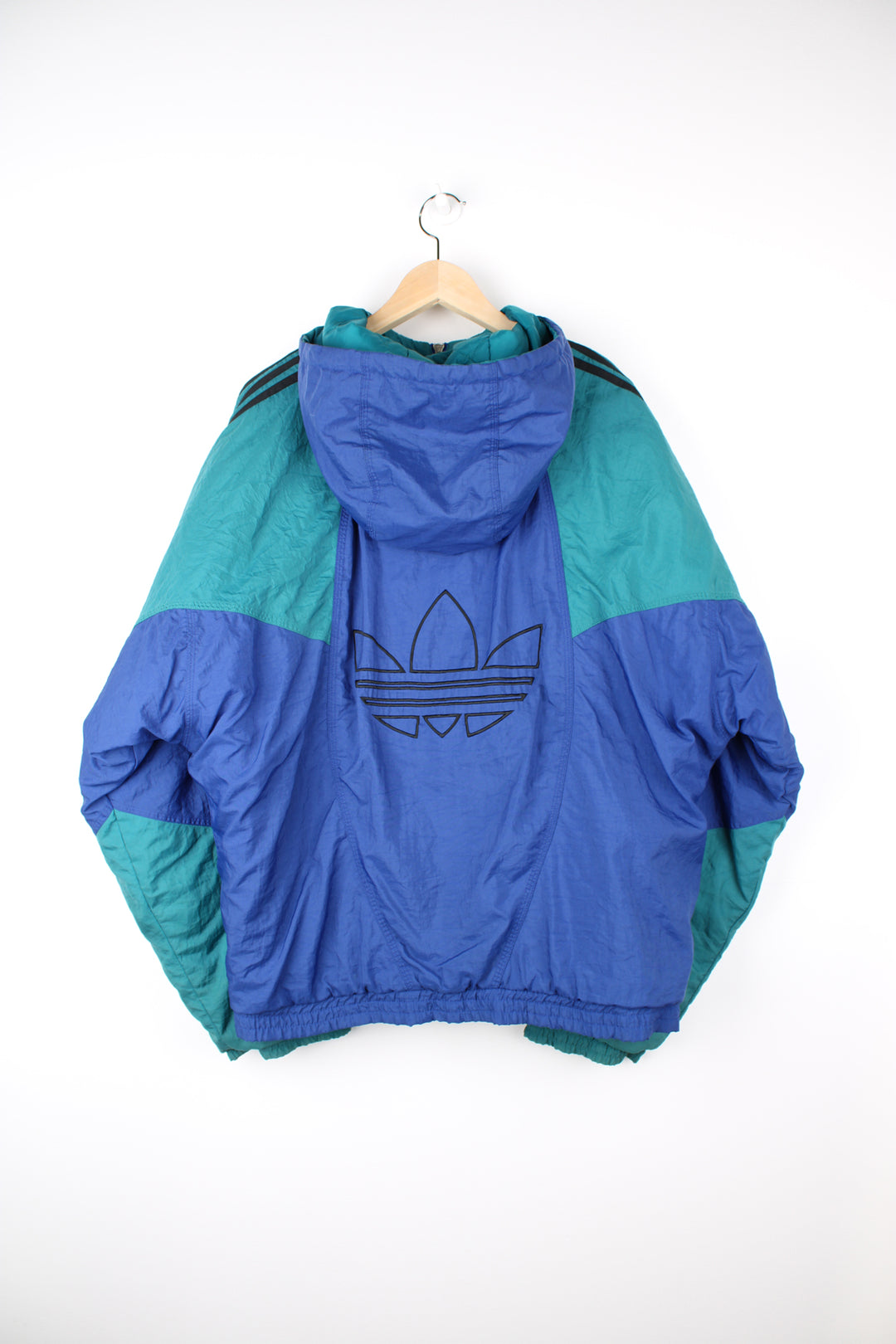 Vintage 90's blue and green Adidas bomber jacket, with embroidered logo on the chest and signature three stripes down the arms