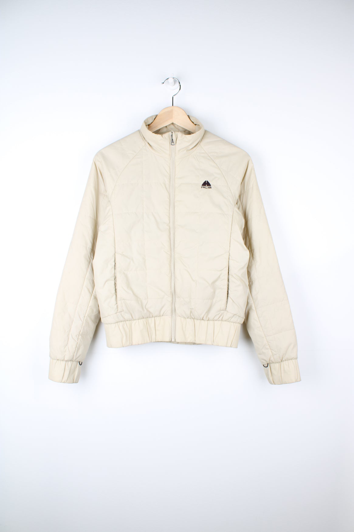 Cream Nike ACG thermal layer lightly padded zip through jacket, features embroidered logo on the chest