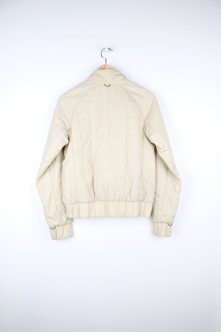 Cream Nike ACG thermal layer lightly padded zip through jacket, features embroidered logo on the chest