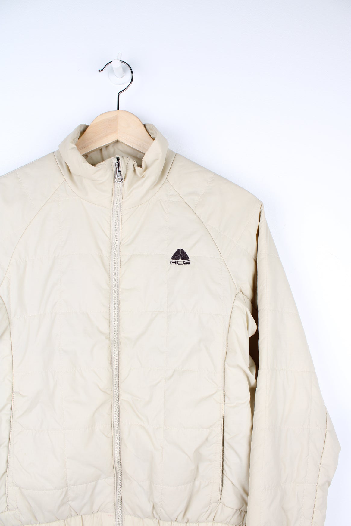 Cream Nike ACG thermal layer lightly padded zip through jacket, features embroidered logo on the chest