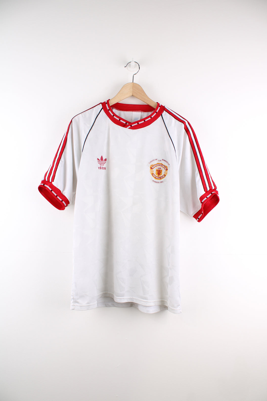 Vintage Adidas, Manchester United 1991 European Cup Winners Shirt in a white and red colourway, and has the logos printed on the front.