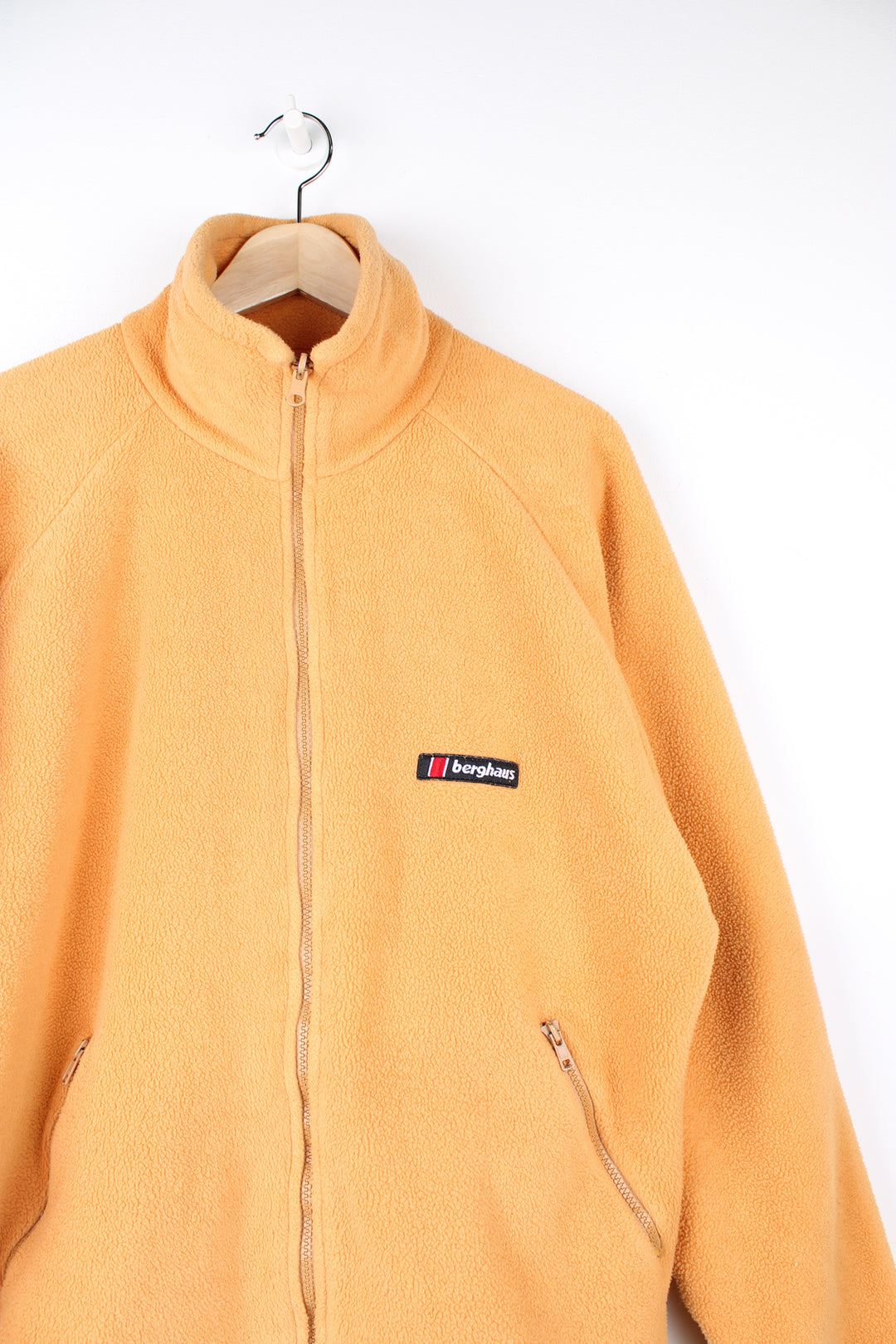 Berghaus Fleece in a yellow colourway, zip up, pockets and has the logo embroidered on the front.