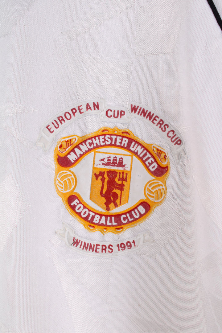 Vintage Adidas, Manchester United 1991 European Cup Winners Shirt in a white and red colourway, and has the logos printed on the front.