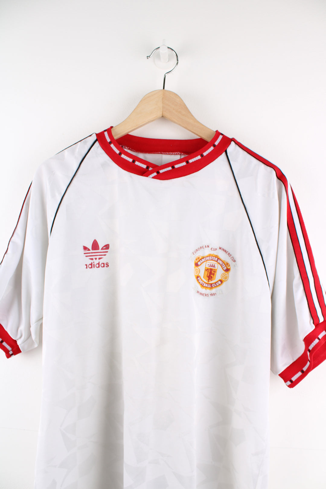 Vintage Adidas, Manchester United 1991 European Cup Winners Shirt in a white and red colourway, and has the logos printed on the front.