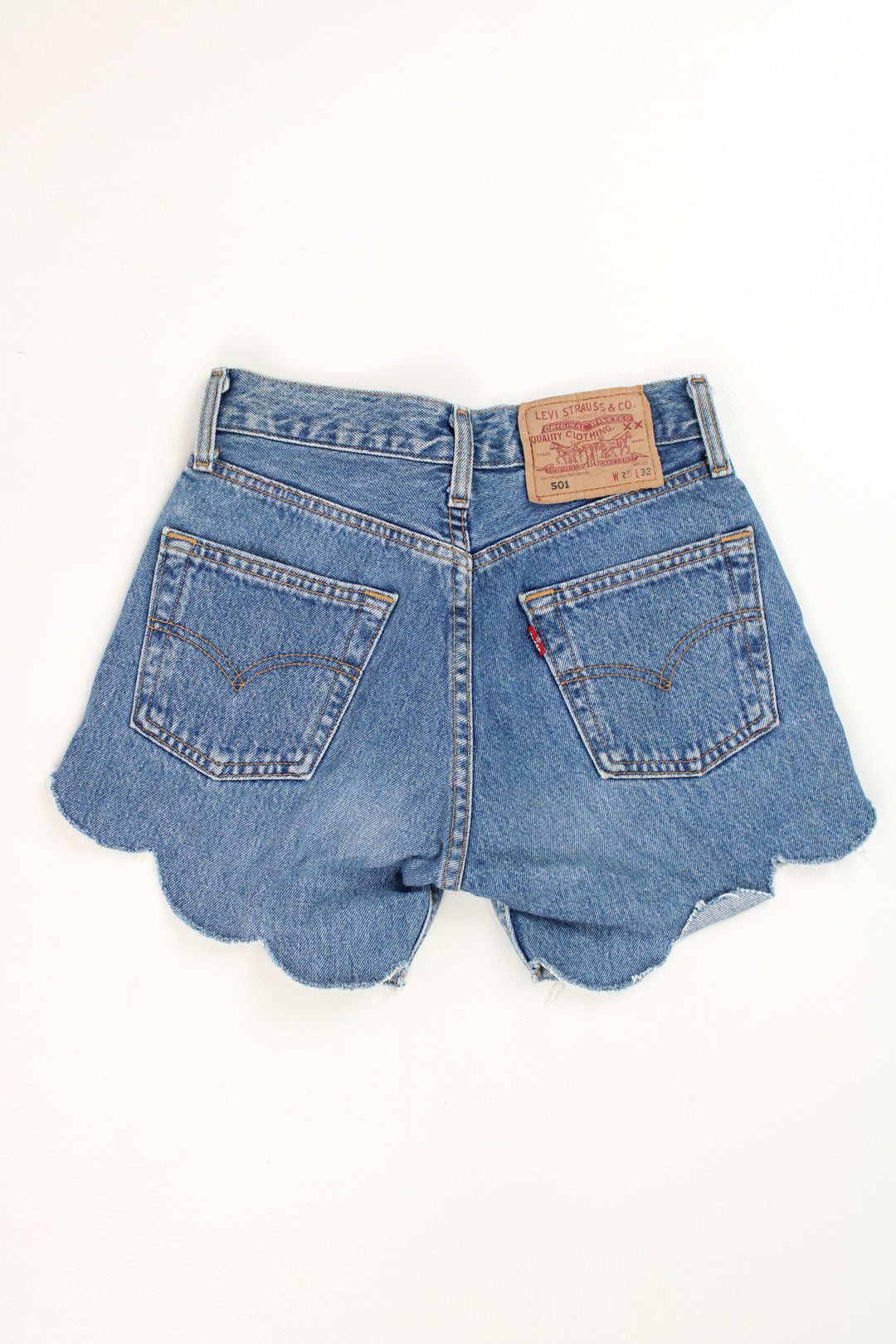 Vintage Levi's 501 blue denim shorts with scalloped edges