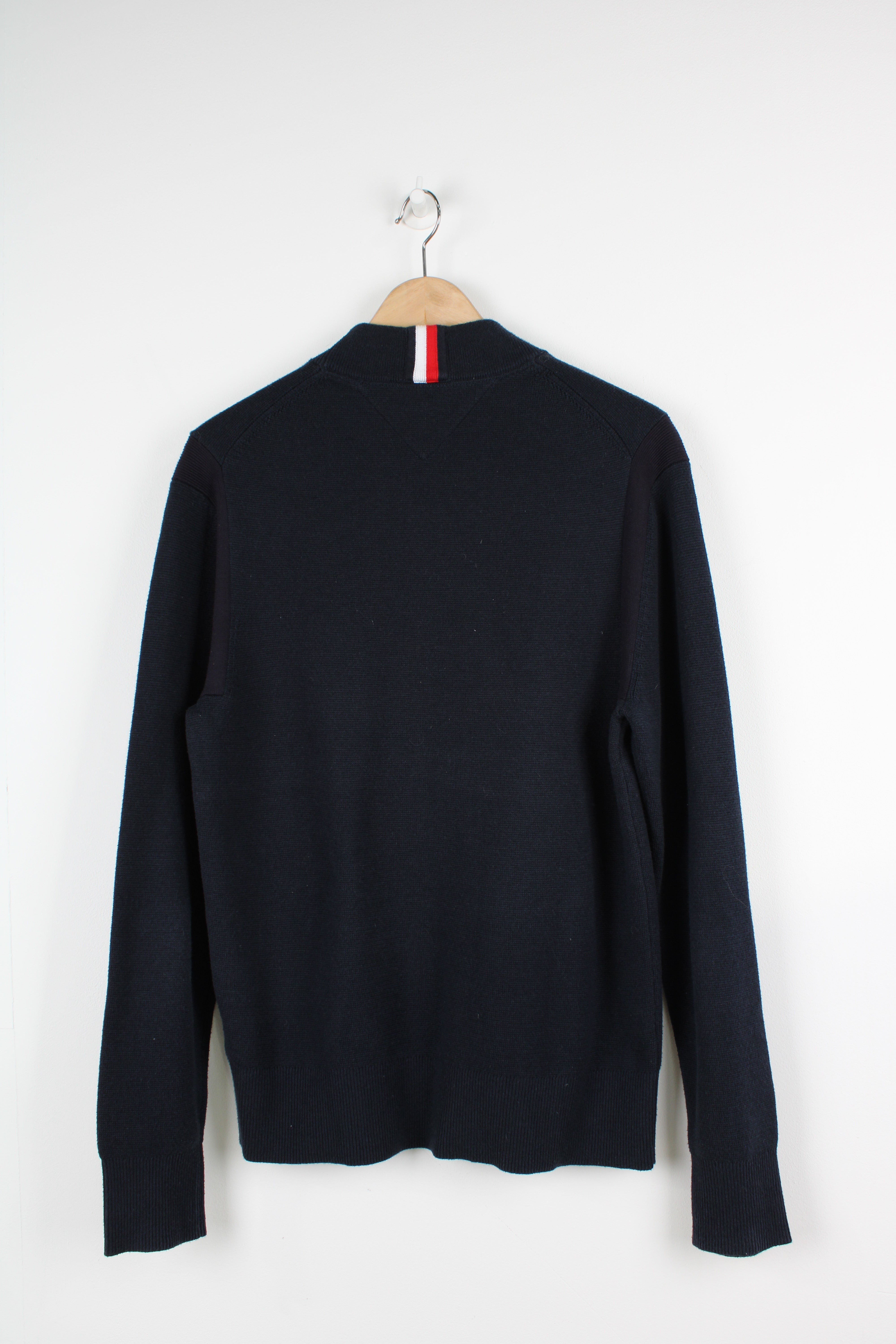 Tommy Hilfiger navy blue high neck knit jumper with embroidered logo on the chest