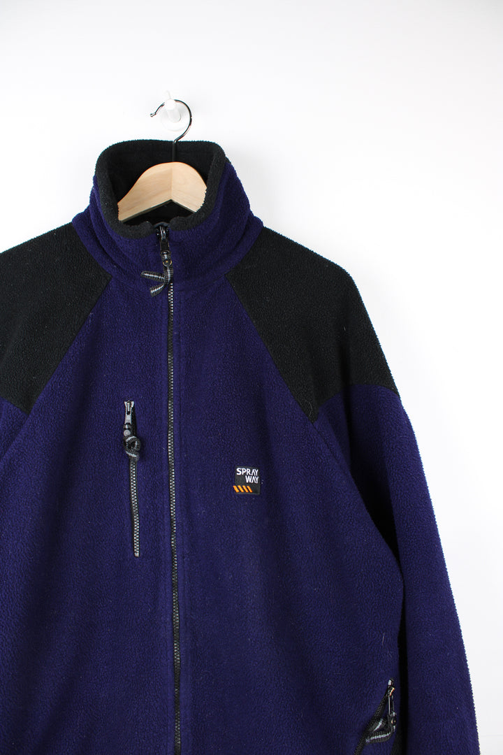 Spray Way Fleece in a purple and black colourway, adjustable collar, zip up, multiple pockets and has the logo embroidered on the front.