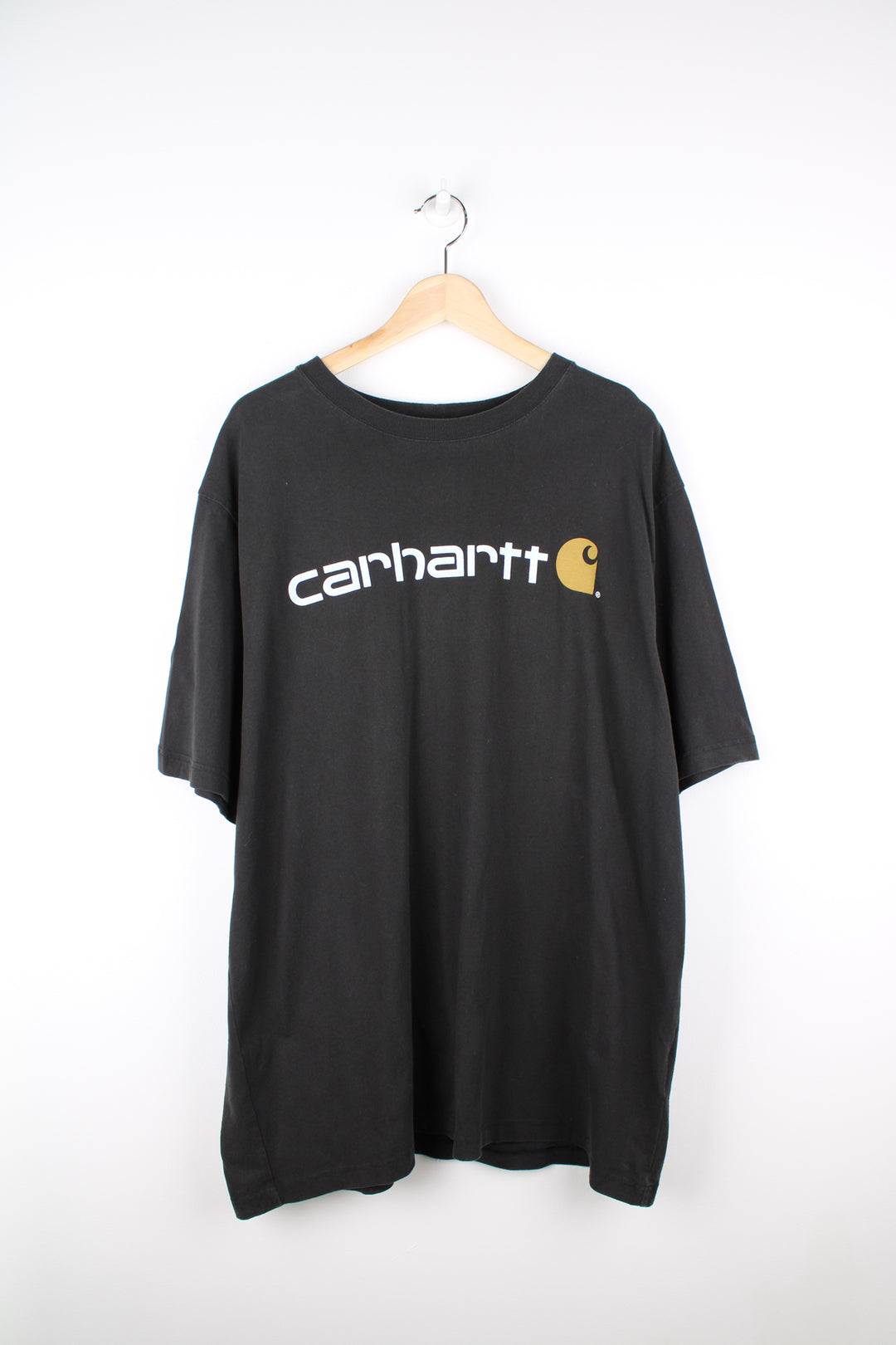 Carhartt all black, loos fit cotton t-shirt. Features printed spell-out logo across the chest