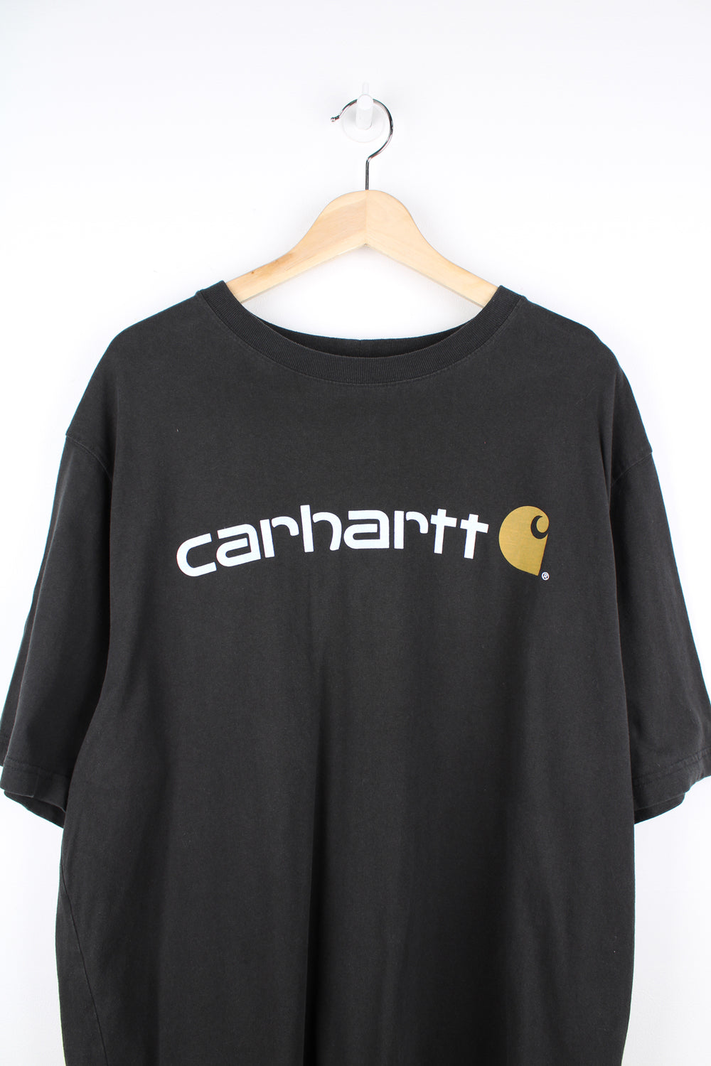 Carhartt all black, loos fit cotton t-shirt. Features printed spell-out logo across the chest