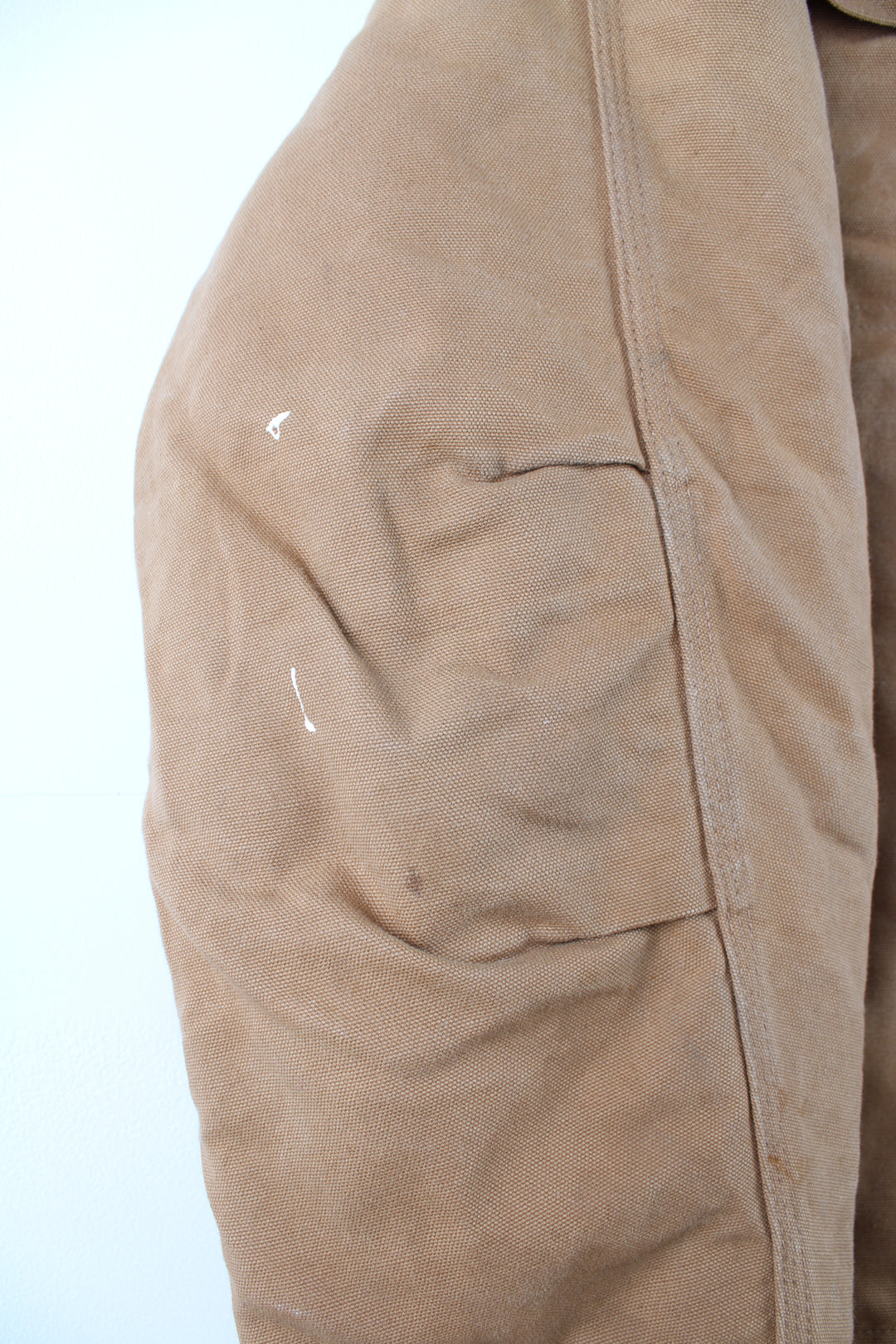 Carhartt Arctic Jacket in a tanned colourway with a brown corduroy collar, zip up, multiple pockets, and has the logo embroidered on the front.