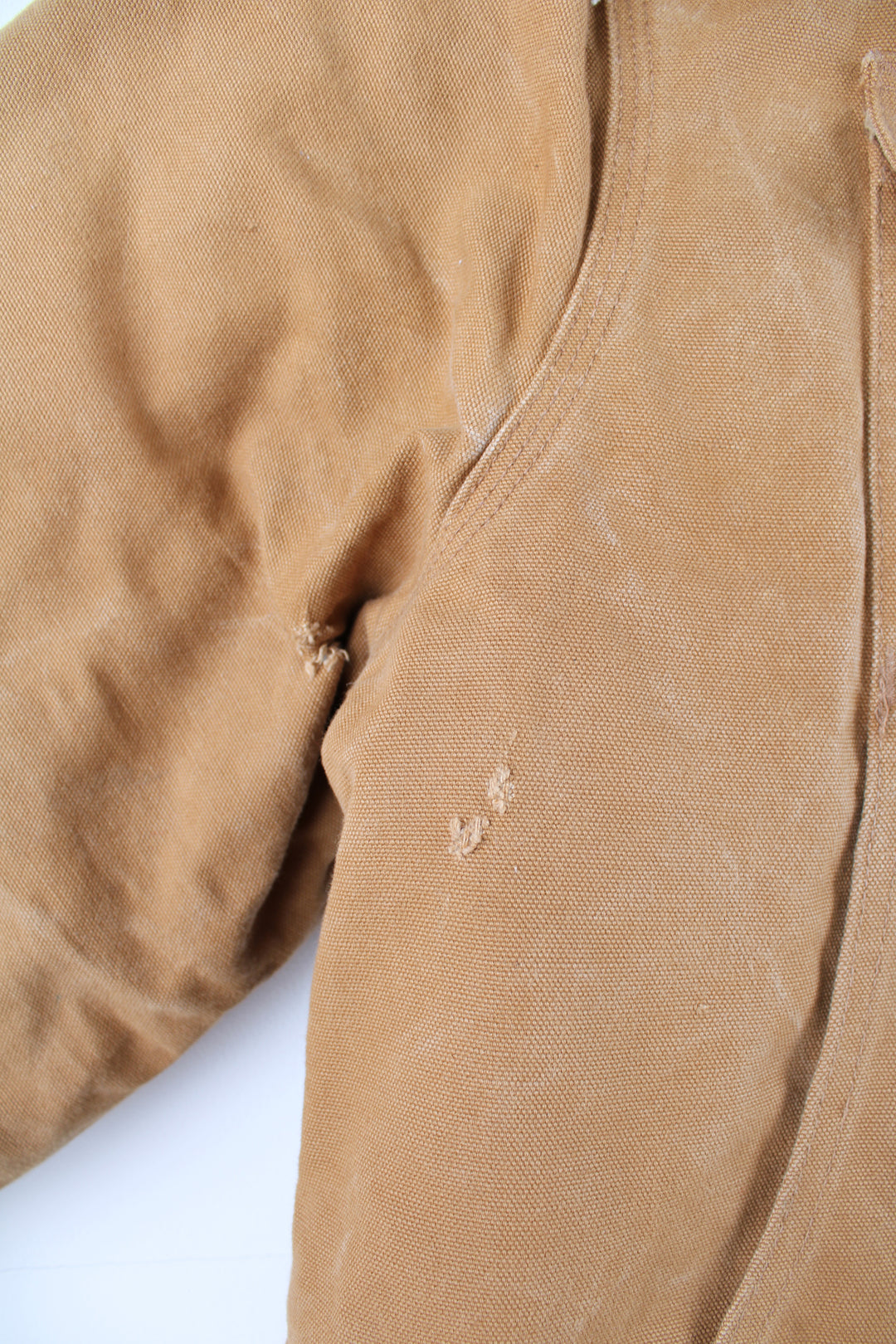 Carhartt Arctic Jacket in a tanned colourway with a brown corduroy collar, zip up, multiple pockets, and has the logo embroidered on the front.