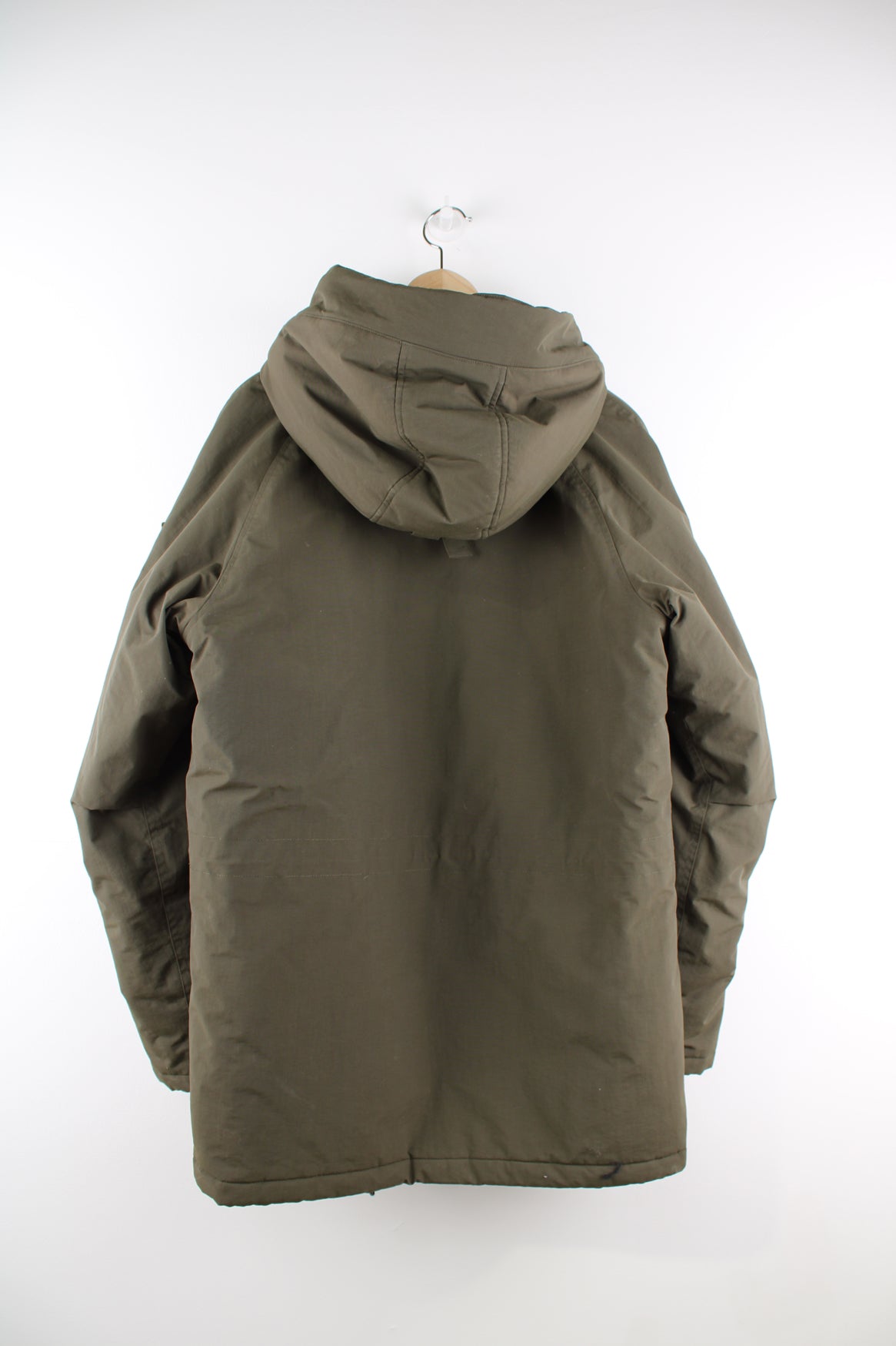 Carhartt Parka Jacket in a green colourway, multiple pockets, hooded with a faux fur lining, zip up, insulated quilted lining, and has the logo embroidered on the front and on the left sleeve.