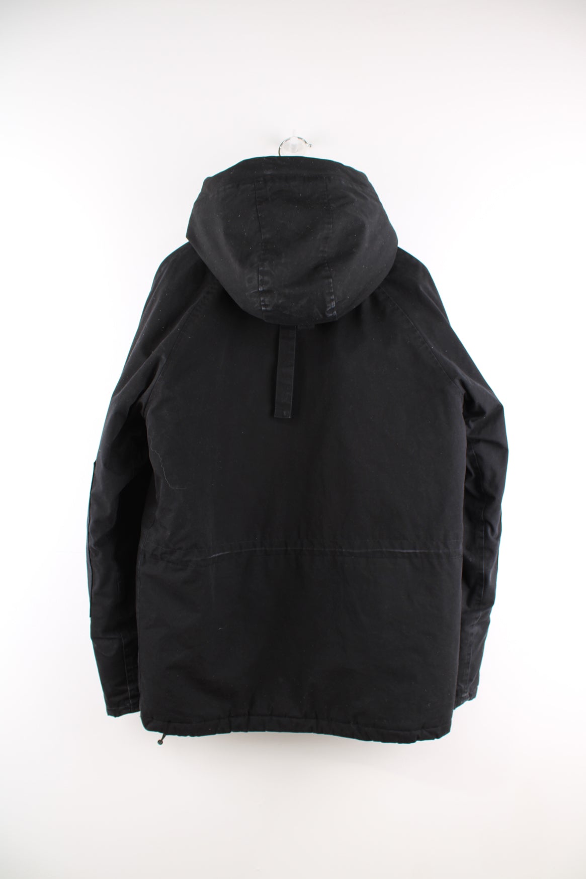 Carhartt Parka Jacket in a black colourway, zip up, multiple pockets, hooded with a faux fur lining and insulated with a quilted lining, and has the logo embroidered on the front.