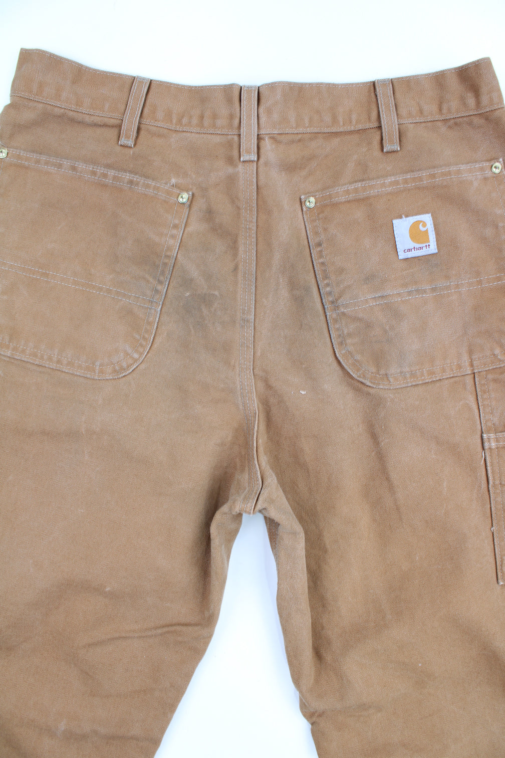 Carhartt double knee carpenter jeans in tan with multiple pockets and signature logo on the back pocket