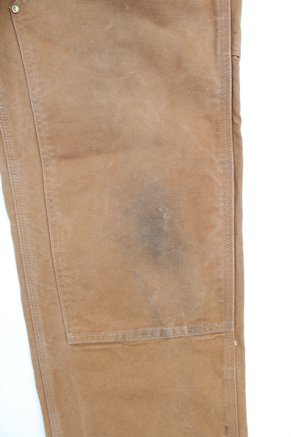 Carhartt double knee carpenter jeans in tan with multiple pockets and signature logo on the back pocket