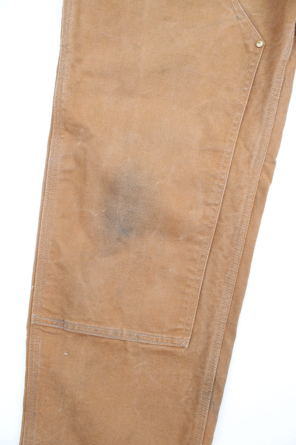 Carhartt double knee carpenter jeans in tan with multiple pockets and signature logo on the back pocket