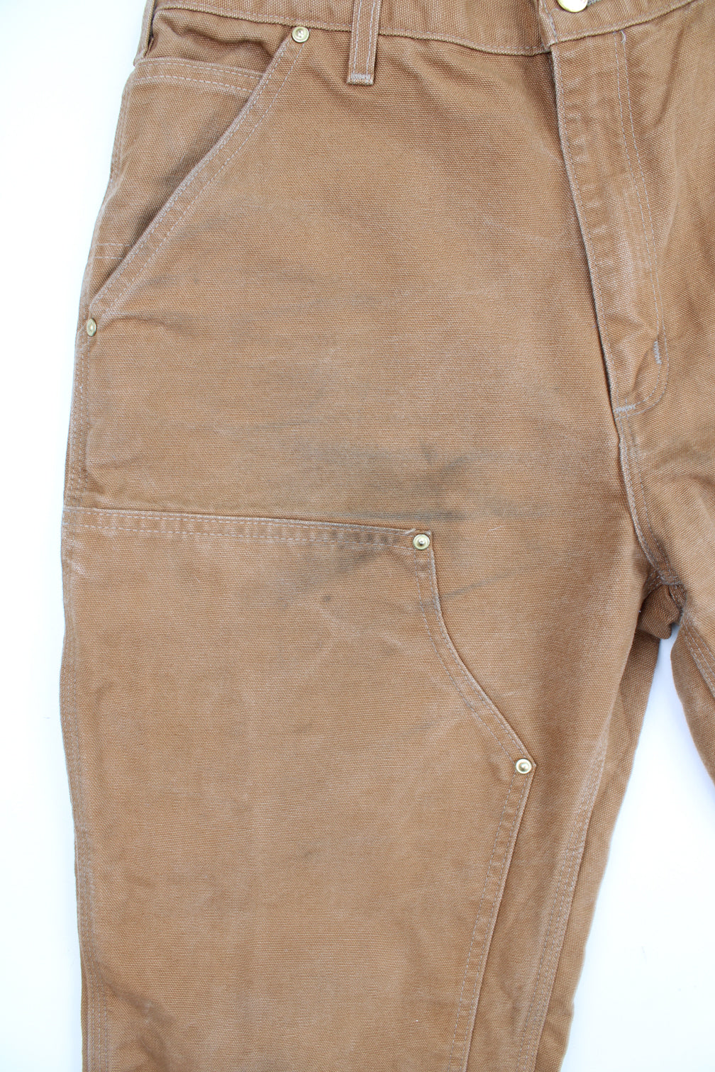 Carhartt double knee carpenter jeans in tan with multiple pockets and signature logo on the back pocket